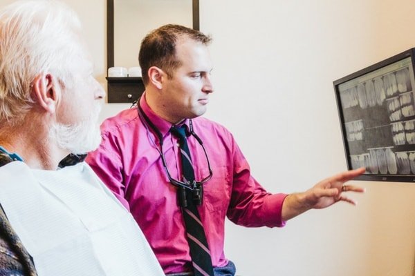 Dr. Paul Wulff discusses denture options with a patient in Prescott, AZ